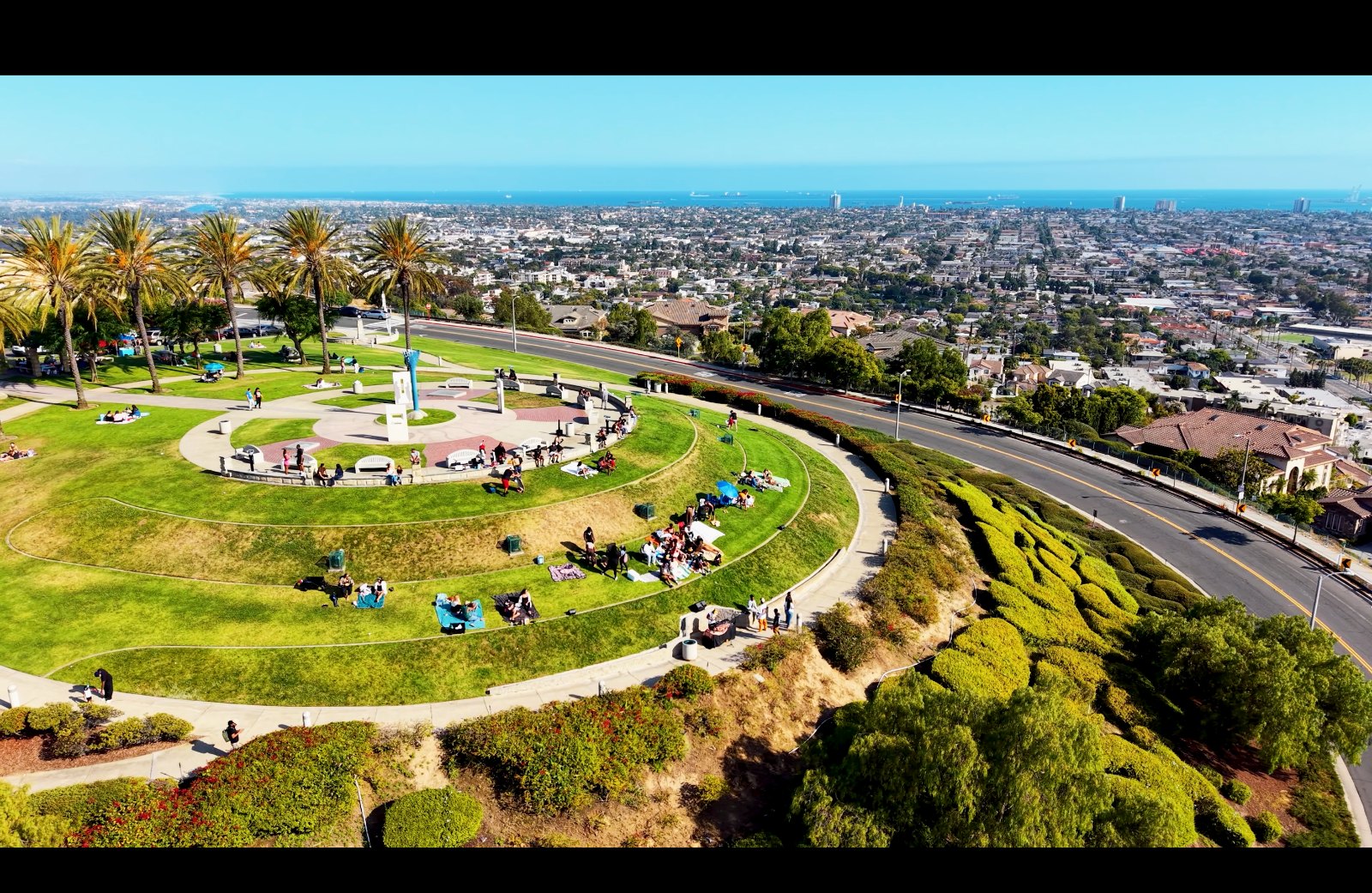 Aerial view of the hilltop park with the ocean in the distance